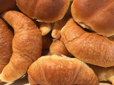 a pile of croissants sitting next to each other at Giesserei in Arbon