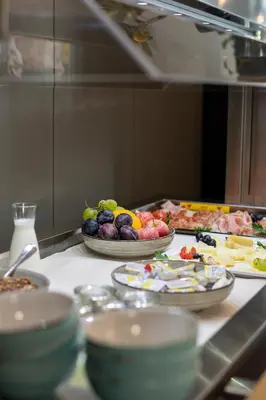 a table with plates of food on it in a kitchen at Giesserei in Arbon