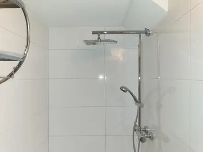 a shower with a glass door in a bathroom at Grosses Apartement 2 Schlafzimmer am Bodensee in Arbon