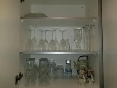 a bunch of glass jars and bottles on a shelf at 3 Doppel Zimmer Apartement in 9320 Arbon in Arbon
