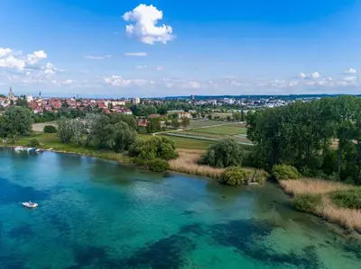 an aerial view of a river with a boat in it at VILLA TAEGERMOOS in Tägerwilen