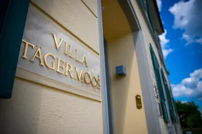 a sign on the side of a building at VILLA TAEGERMOOS in Tägerwilen