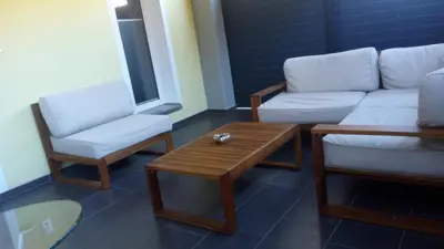 a living room with a couch and a coffee table at 3 Doppelbett Business Apartment am Bodensee in Arbon