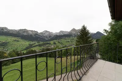a balcony with a view of a mountain at Jambo Pua in Alt Sankt Johann