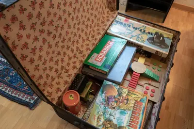 an open suitcase filled with books and other items at Sonnhalde in Wildhaus