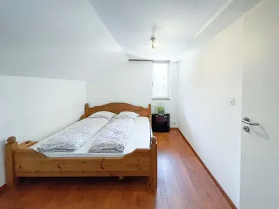 a bedroom with two beds in a room at Säntisecho - in der Natur zu Hause in Urnäsch