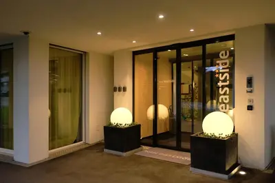 a store front with glass doors in a building at Hotel Eastside (free parking garage) in St. Gallen