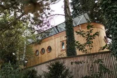 a building with a window on top of a fence at Logis Freyja in Landschlacht Gemeinde Münsterlingen