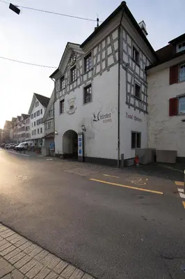 a white building on the side of a street at Hotel Untertor by Maier - Self-Check-in in Altstätten