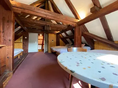 a room with four beds in a attic at Hotel Untertor by Maier - Self-Check-in in Altstätten