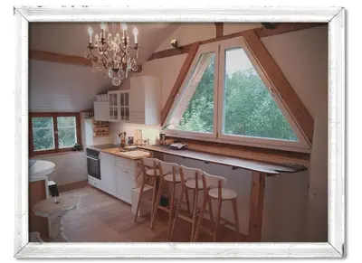 a house on a dirt road in front of a house at Studio Chic mit Whirlpool in Wildhaus