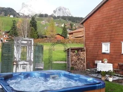 a house in the mountains with a wedding at Studio Chic mit Whirlpool in Wildhaus