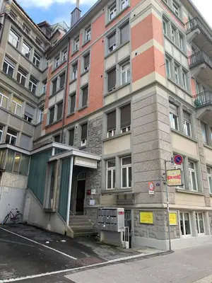 a building on a street in front of a building at over-night City-Flat in St. Gallen