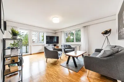 a living room with a couch and chairs and a table at SOHO 11 !Gratis Parken, Free Parking! in Kreuzlingen