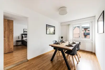 a kitchen and dining room with a table and chairs at SOHO 11 !Gratis Parken, Free Parking! in Kreuzlingen