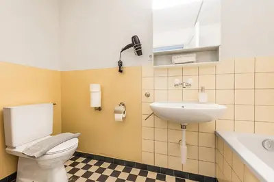 a bathroom with a toilet and a sink at SOHO G !Gratis Parken, Free Parking! in Kreuzlingen