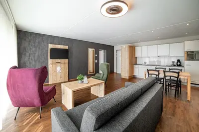 a living room with a couch and a table at Wohntel - wohnen wie im Hotel in Sevelen
