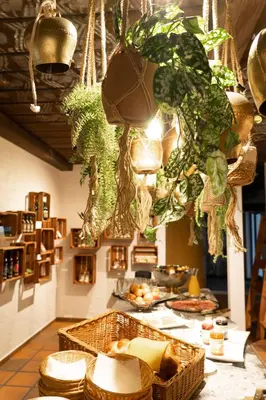 a kitchen with a counter with baskets of food on it at Hotel Säntis Lodge in Unterwasser