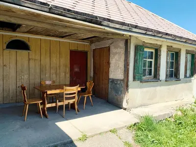 a table and chairs on the porch of a house at NEU renoviert - Bitzi Appenzell – Mit Aussicht in Appenzell