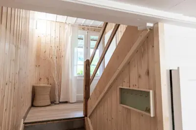 a staircase in a house with wood paneling at Villa Donkey Ferienwohnung 113 in Degersheim