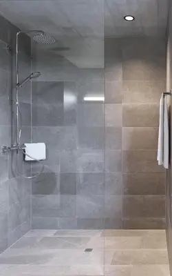 a bathroom with a shower with a glass door at BoHo by Maier - kontaktloser Check-In in Buchs