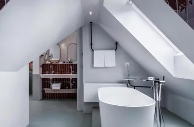 a bathroom with a white toilet and a sink at Sorell Boutique-Hotel City Weissenstein St Gallen in St. Gallen