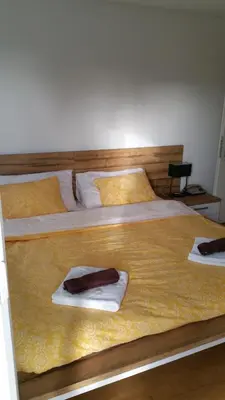 two beds in a bedroom with towels on them at Hotel Ochsen in Sankt Margrethen