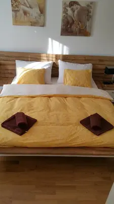 a large bed with two pillows on top of it at Hotel Ochsen in Sankt Margrethen