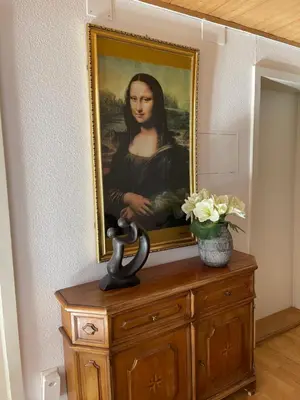 a painting of a woman on top of a dresser at Hotel Ochsen in Sankt Margrethen