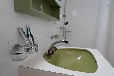 a green sink in a white counter top at Panorama Blick in Unterwasser