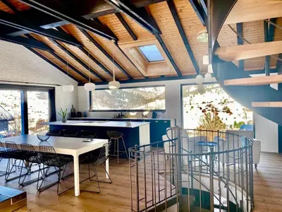 a kitchen with a white table and chairs at Ski-InOut 4BR Alpen Chalet, Views & Fire in Alt Sankt Johann