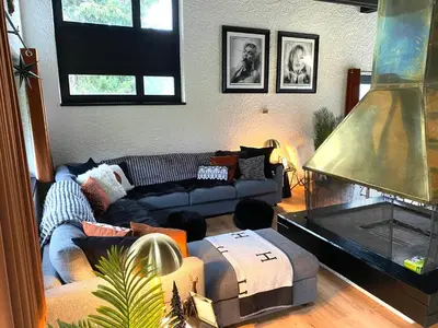 a living room with a couch and a fireplace at Ski-InOut 4BR Alpen Chalet, Views & Fire in Alt Sankt Johann