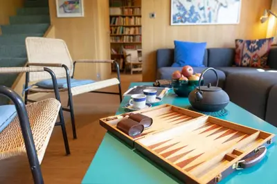 a living room with a table with a tray on it at Etienne in Wildhaus