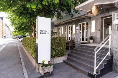 a sign on the side of a building at Self Check-In Hotel David 22 in St. Gallen
