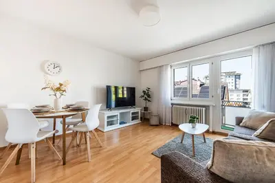 a living room with a table and a couch at SOHO 9 !Gratis Parken, Free Parking! in Kreuzlingen