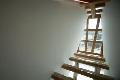 a staircase in a building with a window at Gasthaus zum Trauben in Weinfelden