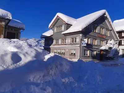 a pile of snow in front of a building at Gasthaus Gemsli in Nesslau