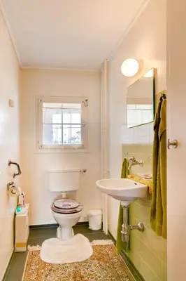 a bathroom with a toilet and a sink at Blattenheimat - im traditionellen Appenzeller Haus in Appenzell