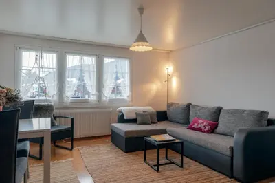 a living room with a couch and a table at Blattenheimat - im traditionellen Appenzeller Haus in Appenzell