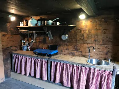 a kitchen with a counter top with a sink at Alphütte Burst in Alt Sankt Johann