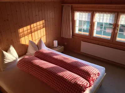 a bedroom with a bed with two pillows on it at BnB-Blomberg in Ebnat
