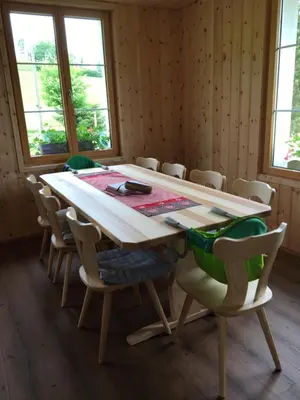 a dining room with a table and chairs at BnB-Blomberg in Ebnat