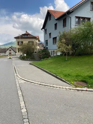 a curvy road with a house and a house at BNB Claudia in Appenzell