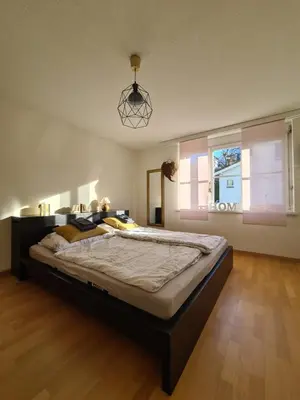 a bedroom with a large bed in a room at HOME AWAY FROM HOME in Staad