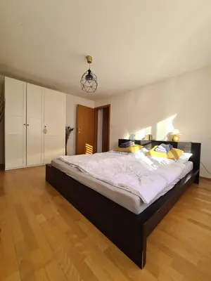 a large bedroom with a large bed in a room at HOME AWAY FROM HOME in Staad