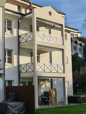 a large apartment building with a large window at HOME AWAY FROM HOME in Staad