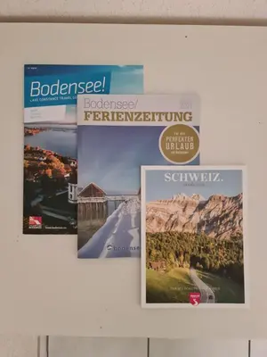 three posters hanging on a wall at HOME AWAY FROM HOME in Staad