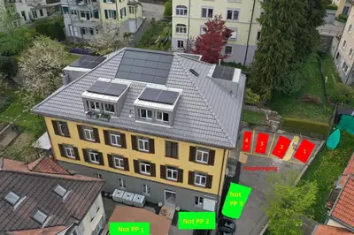 an overhead view of a building with solar panels on it at RUSTICO INN - SIMPLE ROOMS -- OLMA Messen & Autobahn 1 Min, HSG 6 Min, Spital 7min, günstige Parkplätze in St. Gallen