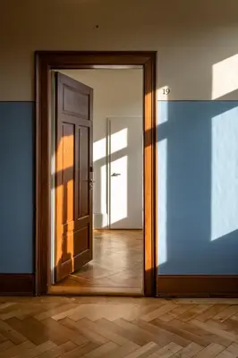 an open door in a room with a wooden floor at Militärkantine St. Gallen in St. Gallen
