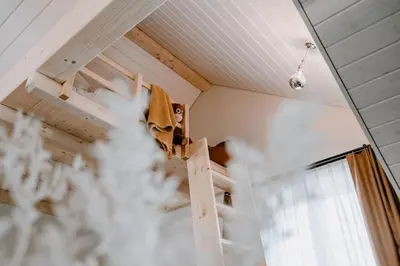 a ladder in a room with a window at Hotel Müllers - Self-Check-in in Arbon